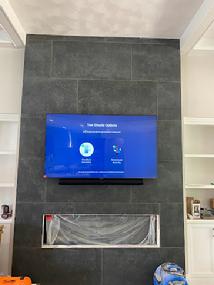 TV mounted on tile fireplace new construction